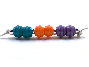 Ribbed Spacers - peacock, yellowish opal orange, and lilac red